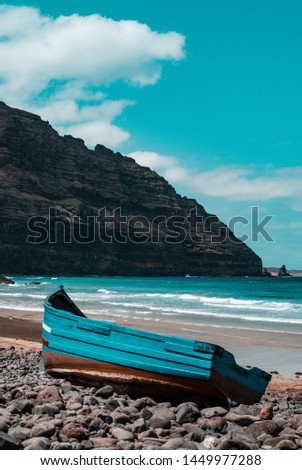 Picture of beach on Lanzarote with Atlantic Ocean, Cliffs and old beached fishing boat