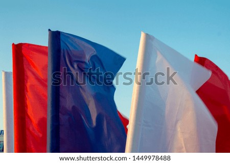 white red and blue flags fluttering in the wind