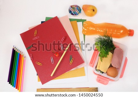 Back to school, Assortment of colored pencils, pens and rulers, juice and school breakfast on a light background, top view. Bright background and colors form extraordinary thinking 