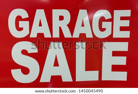 Red and white garage sale sign
