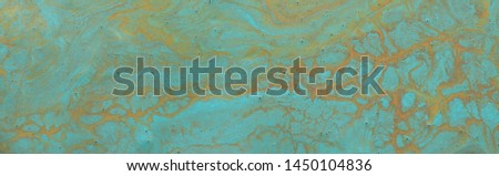 photography of abstract marbleized effect background. Blue, mint, gold and white creative colors. Beautiful paint. banner
