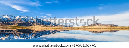Mountain Lake Panorama Landscape Snow Capped Peaks Reflection On Water, Wide Scenic View Of Nature In New Zealand National Park, Tourism Travel Destination Near Christchurch Canterbury, South Island