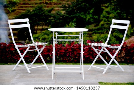 White chairs neatly arranged on the hill
