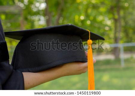 graduation,Student hold hats in hand during commencement success graduates of the university,Concept education congratulation, green park background