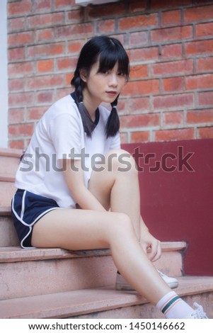 thai teen beautiful girl in japanese sports student uniform happy and relax