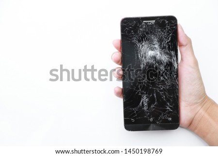 Hand hold smart phone with broken damage on white background. electronic garbage concept 