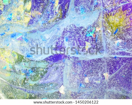 Abstract background of flowers through bubbles. Distorted colors