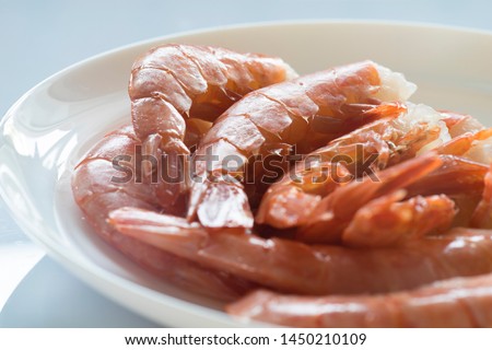 Cooked defrosted shrimps Photo closeup  Prefabricated seafood for further cooking