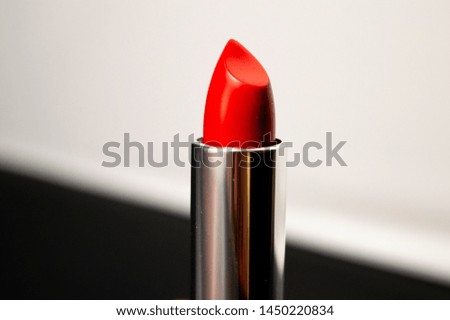 red lipstick, dark background, close up photo
