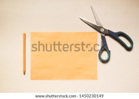 Cardboard, pen and scissors on white background. Digital mock-up stock photo in aesthetic minimal style with free empty copy space for text or artwork design