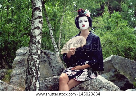 Modern geisha in nature