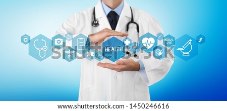 medical coverage insurance concept, hands doctor covering symbols and icons on blue background, copy space and web banner template 