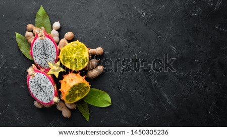 Kiwano and dragon fruit. Tropical Fruits. Top view. Free space for text.