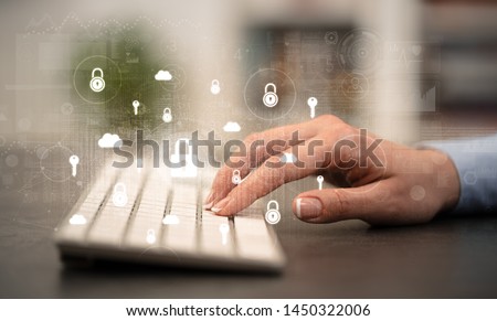 Business woman hand typing on keyboard with secured lock concept around