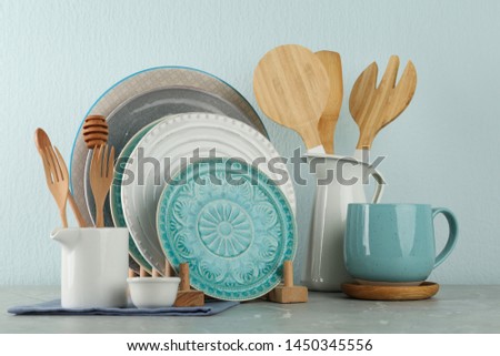 Set of kitchenware on grey marble table near light wall. Modern interior design Royalty-Free Stock Photo #1450345556