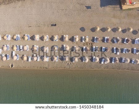 Aerial view of crowded beach full of umbrellas