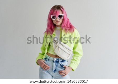 woman with pink hair with glasses