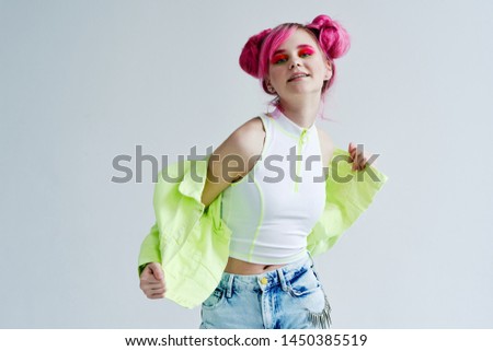 woman with pink hair rejoices