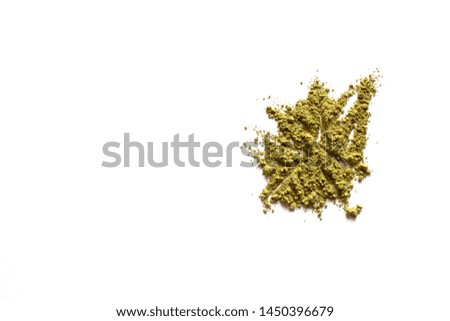 Matcha powder explosion on white background. Top view.  Japanese Culture. Popular Healthy Tea.