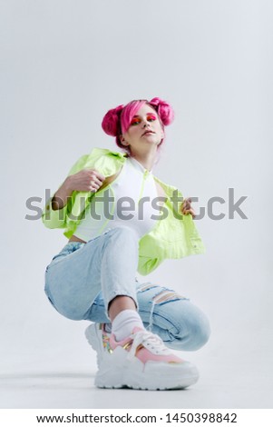 young woman with pink hair sitting