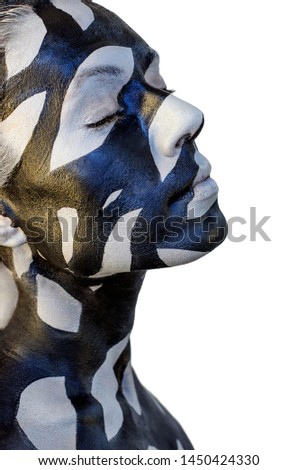 Creative makeup with black and gray stains on womens skin. Conceptual idea of bold body art painting.