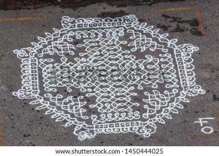 Indian traditional kolam (known in tamil language) or rangoli is drawn using white colored rice, during festival season 52541785 chennai india tamil nadu mylapore