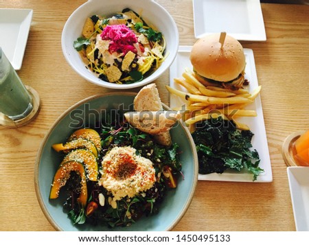 vegetarian food of hamburgers and various vegetable salads