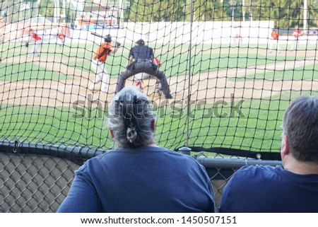 A couple watching a baseball game.