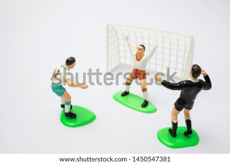 Football player toy on white background