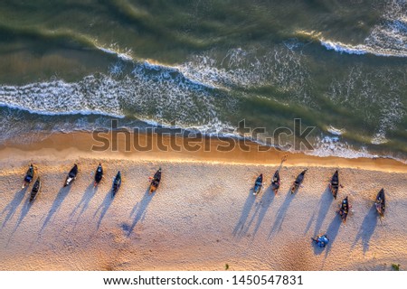 Top view or aerial view of white beach with long tail boats of fisherman in summer of tropical in Vinh Thanh, Hue, Vietnam.
