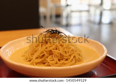 Japanese noodles in a plate on the table in the restaurant