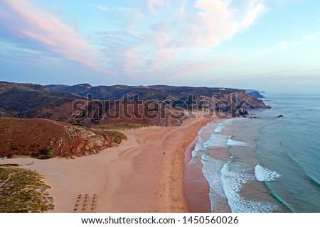 Aerial on Praia Amado on the west coast in Portugal at sunset