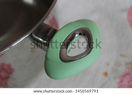 Metal pan handles with silicone inserts