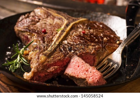 t-bone steak Royalty-Free Stock Photo #145058524