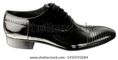 Classic, casual man shoe on a white background taken in a photo studio. Dark and shiny color. Modern style. Man accesory. Close up shoe.