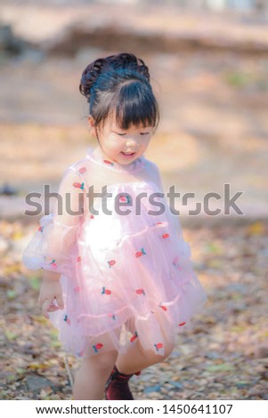 portrait of a girl. little girl feel happy smile in studio shot white backgrouand. Studio portrait of asian girl with happy look in front of white background