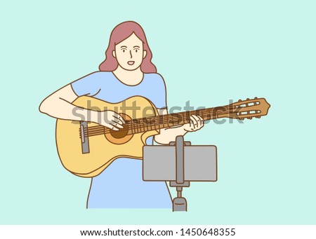 blogger live broadcasting play guitar tutorial viral video clip by smartphone sharing on social media