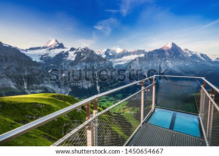 Sunrise view on Bernese range above Bachalpsee lake with Mounch, Eiger Faulhorn and Reti peaks. Popular tourist destination. Location place Switzerland alps, Grindelwald valley, Europe. 