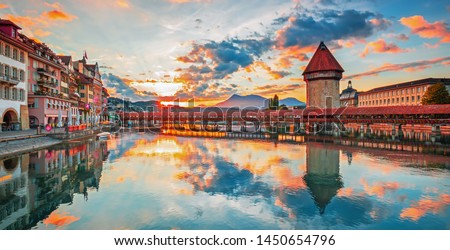 Sunset in historic city center of Lucerne with famous Chapel Bridge and lake Lucerne (Vierwaldstattersee), Canton of Lucerne, Switzerland Royalty-Free Stock Photo #1450654796