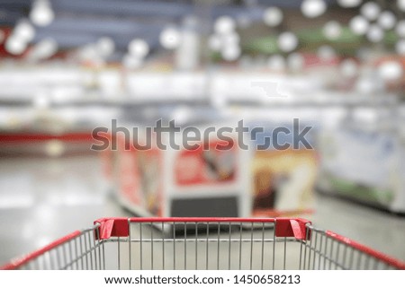 Blurred photo of store with trolley in department store bokeh background