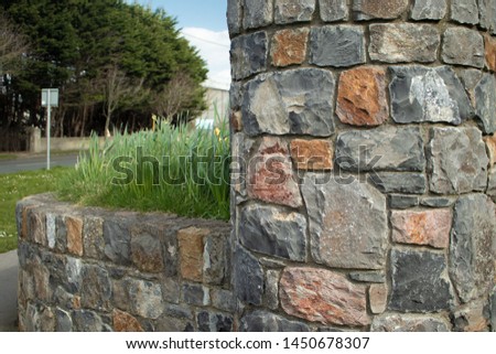old Stone Wall near Street Royalty-Free Stock Photo #1450678307