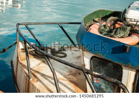old rusty fisherboat on harbour Royalty-Free Stock Photo #1450681295