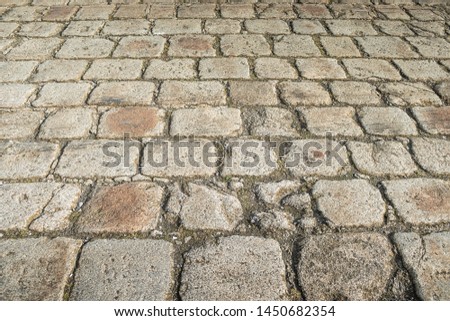 bright dirty cobblestone in perspective Royalty-Free Stock Photo #1450682354