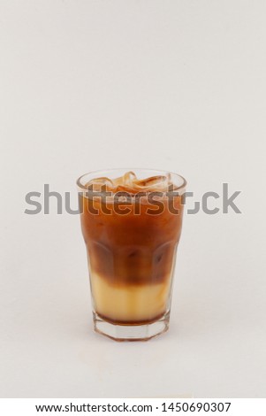 Bumble iced coffee with espresso and fresh orange juice isolated on white background