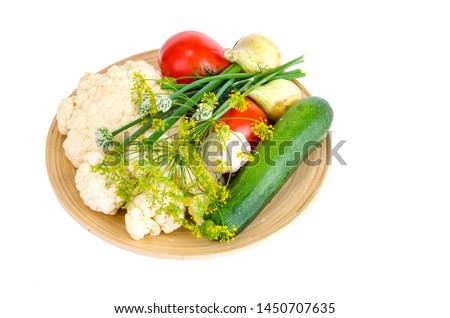 Homemade organic seasonal vegetables on wooden plate. Studio Photo