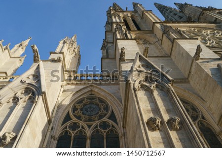 Spires of gothic Cathedral Saint Andre on Square (Place) Pey Berland in downtown of Bordeaux in summer day. High resolution photo. 