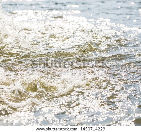 Summer background, river water with splashes close-up