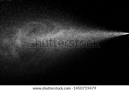 close up of spray water on black background Royalty-Free Stock Photo #1450719479