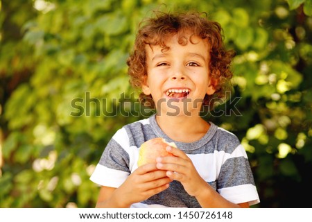 Child kid eating apple fruit outdoor autumn fall nature healthy outdoors