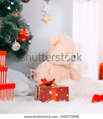 Christmas composition with soft toy and Christmas gifts